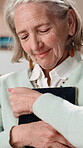 Hug, picture frame and senior woman in home, smile and mourning with memories, thinking or remember. Happy, elderly person and embrace for photo in house, retirement and reflection with reminder