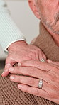 Empathy, hands and shoulder with senior couple in retirement home together for comfort or support. Love, sympathy or understanding with elderly man and woman in apartment for grief, loss or pain
