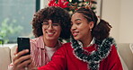 Selfie, couple and celebration of Christmas, smile and profile picture for festive season in lounge. Love, man and bonding with woman in living room, photography and memory on social media in home