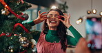 Picture, decorations and woman by christmas tree in home for memory or social media post. Happy, photography and female person with baubles for camera at festive, celebration or xmas party in house.
