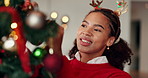 Christmas tree, happy and woman in home decorating for holiday, vacation and festive season. December, party and person with baubles, ornaments and lights for xmas tradition, aesthetic or celebration