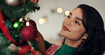 Christmas, tree and woman in home for decorating for holiday, vacation and festive season. Happy, December and person with baubles, ornaments and sparkle for xmas tradition, aesthetic and celebration