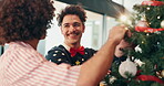 Christmas, tree and smile with friends in home for festive season, celebration and decoration. Happiness, bonding and xmas holiday with men in living room for tinsel, ornament and support together