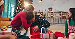 Christmas, friends and surprise with present on floor for secret santa, support or thank you. Social event, festive party and happy people with gratitude for gift giving and holiday tradition in home