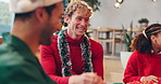 Christmas, friends or talking with laughing in home for holiday celebration, friendmas party or fun. Social gathering, group and happy people in living room for festive, bonding or funny conversation