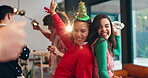 Dance, Christmas and laugh with friends in party for social, festive holiday and happiness. Merry xmas season, bonding and reunion celebration with group of people in home for love, support and music