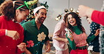 Dance, Christmas and holiday with friends in party for social, festive jingle bells and happiness. Merry xmas season, bonding and reunion celebration with people in home for love, support and music