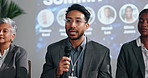 Mic, speaker and man in panel for forum, climate change awareness and renewable energy. Presentation, talk show and people on stage in discussion for sustainability, event or eco friendly convention