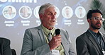 Summit, speaker or man in panel to talk for global economy, awareness forum or finance resources. Stage, education and people in meeting with guest or mic for financial growth, solution or convention