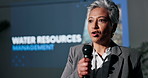 Presentation, speech and woman with mic on a stage for ecology seminar, tradeshow and conference. Sustainable business, speaker and person for water resources management, workshop and solution