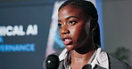 Conference, black woman and speaker with microphone at event for ethical ai and data governance. Female guest, convention or seminar by screen for learning about future of internet or tech