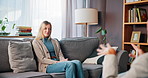 Psychology, sofa and woman with therapist in office for advice, life coaching or support. Conversation, consultation and female person with counsellor for mental health, help or self care in clinic.
