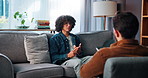 Therapy, sofa and man with talking in counseling, anxiety management and healing with psychologist. Psychology, male patient and therapist with tablet for assessment, listening and share recovery