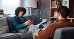 Psychology, sofa and man with talking in counseling, anxiety management and healing with therapist. Therapy, male patient and psychologist with notebook for assessment, listening and share recovery