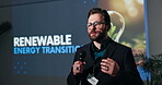 Speaker, seminar and man with microphone for sustainability with renewable energy transition. Male leader, convention or conference for learning of climate change, innovation or environment on screen