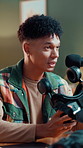 Microphone, podcast and man with review on headphones for advice, broadcast or social media. Audio tech, subscription and male influencer with live streaming online with equipment for talk show.