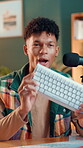 Keyboard, live streaming and influencer with man in studio for gaming pad, ergonomic and review Product feedback, tech guide and content creator with person in home for recording and promotion