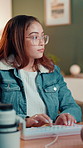Videographer, woman and typing on computer for video editing on post production software. Keyboard, creative editor and work at home for visual effects, film and social media footage to boost views