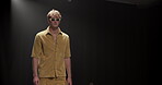 Fashion, luxury and runway with man at event for designer collection, clothing showcase and couture. Fabric, wardrobe and catwalk show with model walking on stage for trendy, and style industry