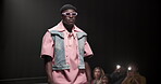 Fashion, walking and showcase with man at runway for designer clothes collection, event and couture. Fabric, wardrobe and luxury catwalk show with model on stage for trendy, and style industry