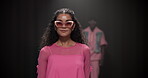Fashion week, pose and designer with woman on runway for event showcase, luxury industry and outfit. Couture line, trendy wardrobe and catwalk with people on stage for style collection and clothes