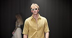 Fashion week, event and designer with man on runway for clothes showcase, luxury industry and outfit. Couture line, trendy wardrobe and catwalk with people walking on stage for style collection