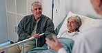 Doctor, elderly couple and patient on hospital bed for healthcare, treatment or recovery at clinic. Senior, man and woman listening to medical professional in relief for health diagnosis or good news