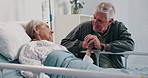 Talking, hospital bed and mature couple holding hands for comfort, support and empathy for recovery. Healthcare, marriage and senior man and woman visit for compassion, care and help for wellness