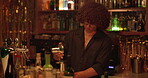 Man, drink and bartender mixing at a pub for job, martini or happy hour at counter. Person, mixologist and barman with alcohol beverage at bar or nightclub for drinking, social event and party