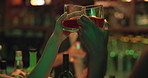 Friends, drink and toast with people at a pub for celebration, fun or night out at bartender counter. Women, cheers and alcohol glass at bar or nightclub for drinking, social event and party