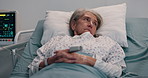 Senior woman, sad and thinking in hospital bed with reflection, sick and recovery in retirement. Elderly person, tired and exhausted with illness, rehabilitation and healing for wellness at clinic
