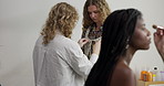 Woman, model and stylist help for photoshoot, production or fashion interview in studio. Behind the scenes, wardrobe and beautician in media agency with designer, cosmetology and creative industry