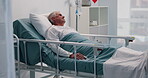 Senior man, resting and bed in hospital for post surgery, recovery and healing from procedure. Elderly patient, awake and iv drip for healthcare services, wellness and treatment from operation in ICU