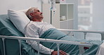 Bed, IV drip and senior man in hospital for treatment, healing or surgery recovery with liquid medication. Relax, health insurance and elderly male patient in ward for medical care at clinic.