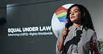 Business woman, speech and seminar with mic for LGBTQ awareness campaign, presentation or equality. Female person, presenter or speaker talking at summit for global human rights or pride community