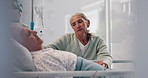 Sad, elderly couple and holding hands by hospital bed to support cancer patient in coma. Clinic visitor, woman or sick man with disease, depression or comfort with hope for health recovery in hospice