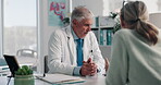 Mature doctor, man and woman for advice, consultation and medical services or professional opinion. People, talk and patient in clinic for appointment, checkup or healthcare with explaining diagnosis