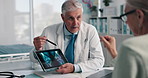 Doctor, senior woman and tablet for x ray with review for broken bones, osteoporosis or knee pain. People, touchscreen and medical consulting for arthritis, feedback and report for wellness at clinic