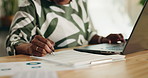 Black woman, hands and writing with laptop for accounting, financial planning or budget at home. Female person, audit and finance research with computer or documents for online expenses or bills