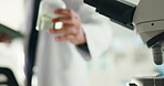 Person, microscope and scientist for chemistry in lab for experiment, medical study and cure. Man, tablet and liquid for chemical solution, research and healthcare innovation and vaccine development
