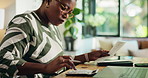 Black woman, accounting and home with calculator on laptop for finance, expenses or bills. Female person, receipt or invoices with calculation for financial planning, audit or bank statement at house