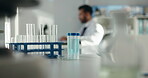 Laboratory, science and test tube with medical container for research, experiment or chemistry. Chemical, glass and equipment with person on tablet for exam, cure development or healthcare innovation