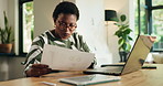 Black woman, documents and home with laptop for analysis, performance review or statistics. Female person, accountant or financial analyst with paperwork on computer for finance or budget at house