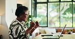 Happy, black woman and home with fist pump on laptop for winning bonus, good news or success. Excited, female person or remote worker with smile on computer for online offer or promotion ar house