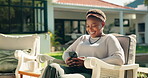 Smile, black woman and relax with phone at house for browsing, social media and weekend break. Happy, female person and mobile for reading blog, streaming movies and funny notification in backyard
