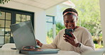 Laptop, freelancer and phone with black woman in home for research, typing and blog. Communication, email list and remote work with person and earphones for entrepreneur, reading and networking