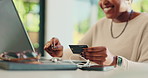 Black woman, credit card and hands with laptop for typing, online shopping and fintech savings in home. Smile, payment and finance for sales, password and code for financial app or ecommerce budget