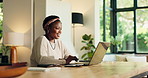 Laptop, typing and black woman in home office for hybrid work, accounting and audit approval. Computer, happy freelancer and reading email for bookkeeping, revenue increase and financial results
