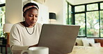 Remote work, black woman and typing on laptop for information, copywriting and research for seo. Home, female person and content writer with tech for newsletter, online blog or serious for freelancer