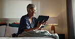 Home, bedroom and old woman with tablet for reading, knowledge and online literature in retirement. House, senior person and learning with digital of fiction, ebook and hobby for pensioner with novel